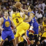 
              In this photo taken Tuesday, June 9, 2015, Cleveland Cavaliers guard Matthew Dellavedova (8) makes a shot and is fouled by Golden State Warriors guard Stephen Curry (30) during the fourth quarter in Game 3 of basketball's NBA Finals in Cleveland. Dellavedova, who has emerged as an unlikely star during this postseason, was hospitalized early Wednesday, June 10, after suffering from severe cramps after the Cavs' 96-91 win Game 3. (AP Photo/Tony Dejak)
            