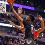 
              FILE - In this April 2, 2014, file photo, McDonald's West All-American Emmanuel Mudiay (0) shoots during the first half of the McDonald's All-American boy's basketball game in Chicago.  (AP Photo/Charles Rex Arbogast, File)
            