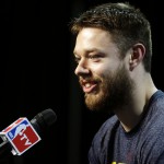 
              Cleveland Cavaliers guard Matthew Dellavedova (8) answers a question during a press conference for basketball's NBA Finals in Cleveland, Wednesday, June 10, 2015. The Cavaliers lead the Warriors 2-1 in the best-of-seven games series.  Game 4 is scheduled for  Thursday. (AP Photo/Michael Conroy)
            