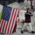 United States' Julie Chu carries her nation's flag while participating in the closing ceremony of the 2014 Winter Olympics, Sunday, Feb. 23, 2014, in Sochi, Russia. (AP Photo/Charlie Riedel)