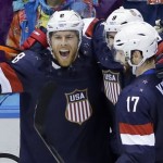 USA forward Joe Pavelski reacts with teammates after scoring a goal against Russia in the third period of a men's ice hockey game at the 2014 Winter Olympics, Saturday, Feb. 15, 2014, in Sochi, Russia. (AP Photo/David J. Phillip)