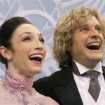Meryl Davis and Charlie White of the United States smile as they wait in the results area after competing in the ice dance short dance figure skating competition at the Iceberg Skating Palace during the 2014 Winter Olympics, Sunday, Feb. 16, 2014, in Sochi, Russia. (AP Photo/Vadim Ghirda)