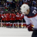 Team Canada celebrates after beating the USA 1-0 in a men's semifinal ice hockey game at the 2014 Winter Olympics, Friday, Feb. 21, 2014, in Sochi, Russia. (AP Photo/Petr David Josek)