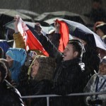 Spectators cheer while watching the medal ceremonies at the 2014 Winter Olympics, Tuesday, Feb. 18, 2014, in Sochi, Russia. (AP Photo/Morry Gash)