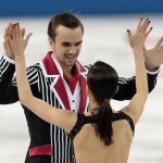 Ksenia Stolbova and Fedor Klimov of Russia congratulate each other after competing in the team pairs free skate figure skating competition at the Iceberg Skating Palace during the 2014 Winter Olympics, Saturday, Feb. 8, 2014, in Sochi, Russia. (AP Photo/Ivan Sekretarev)
