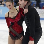 Stefania Berton and Ondrej Hotarek, of Italy, leave the ice after competing in the team pairs free skate figure skating competition at the Iceberg Skating Palace during the 2014 Winter Olympics, Saturday, Feb. 8, 2014, in Sochi, Russia. (AP Photo/Darron Cummings, Pool)