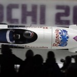 The team from Russia RUS-1, piloted by Olga Stulneva with brakeman Liudmila Udobkina, take a curve during the women's bobsled competition at the 2014 Winter Olympics, Wednesday, Feb. 19, 2014, in Krasnaya Polyana, Russia. (AP Photo/Dita Alangkara)