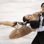 Alisa Agafonova and Alper Ucar of Turkey compete in the ice dance short dance figure skating competition at the Iceberg Skating Palace during the 2014 Winter Olympics, Sunday, Feb. 16, 2014, in Sochi, Russia. (AP Photo/Bernat Armangue)