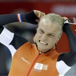 Silver medalist Koen Verweij of the Netherlands grabs his hair when the race was declared a tie with gold medalist Poland's Zbigniew Brodka in the men's 1,500-meter speedskating race at the Adler Arena Skating Center during the 2014 Winter Olympics in Sochi, Russia, Saturday, Feb. 15, 2014. Verweij later was later declared silver, losing by three thousandth of a second. (AP Photo/Patrick Semansky)