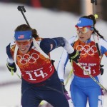 United States' Susan Dunklee, left, and Italy's Dorothea Wierer ski during the women's biathlon 4x6k relay, at the 2014 Winter Olympics, Friday, Feb. 21, 2014, in Krasnaya Polyana, Russia. (AP Photo/Dmitry Lovetsky)