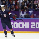 USA forward T.J. Oshie reacts after scoring the winning goal in a shootout against Russia during overtime of a men's ice hockey game at the 2014 Winter Olympics, Saturday, Feb. 15, 2014, in Sochi, Russia. (AP Photo/Mark Humphrey)