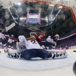 Marie-Philip Poulin of Canada (29) scores past USA goalkeeper Jessie Vetter (31) during the women's gold medal ice hockey game at the 2014 Winter Olympics, Thursday, Feb. 20, 2014, in Sochi, Russia. (AP Photo/Mark Blinch, Pool)