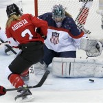 USA goalkeeper Jessie Vetter (31) blocks Meghan Agosta-Marciano of Canada (2) shot on the goal during the second period of the women's gold medal ice hockey game at the 2014 Winter Olympics, Thursday, Feb. 20, 2014, in Sochi, Russia. (AP Photo/Petr David Josek)