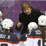 USA head coach Katey Stone talks to the team during a break in the action against Canada in the second period of the women's gold medal ice hockey game at the 2014 Winter Olympics, Thursday, Feb. 20, 2014, in Sochi, Russia. (AP Photo/Petr David Josek)