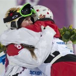  Gold medalist Canada's Justine Dufour-Lapointe, right, hugs her sister and silver medalist Chloe Dufour-Lapointe, after the women's moguls freestyle skiing event at the Rosa Khutor Extreme Park, at the 2014 Sochi Winter Olympics, Saturday, Feb. 8, 2014, in Krasnaya Polyana, Russia. (AP Photo/The Canadian Press, Adrian Wyld)
