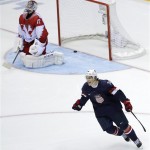 USA forward T.J. Oshie reacts after scoring the winning goal against Russia goaltender Sergei Bobrovski in a shootout during overtime of a men's ice hockey game at the 2014 Winter Olympics, Saturday, Feb. 15, 2014, in Sochi, Russia. (AP Photo/David J. Phillip)

	