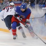 Czech Republic forward Jakub Voracek takes control of the puck from USA defenseman Kevin Shattenkirk during the first period of men's quarterfinal hockey game in Shayba Arena at the 2014 Winter Olympics, Wednesday, Feb. 19, 2014, in Sochi, Russia. (AP Photo/Petr David Josek)