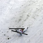 Australia's Lydia Lassila crashes during the women's freestyle skiing aerials qualifying at the Rosa Khutor Extreme Park, at the 2014 Winter Olympics, Friday, Feb. 14, 2014, in Krasnaya Polyana, Russia. (AP Photo/Andy Wong)