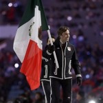 Hubertus Von Hoh of Mexico carries the national flag as he enters the stadium during the opening ceremony of the 2014 Winter Olympics in Sochi, Russia, Friday, Feb. 7, 2014. (AP Photo/Patrick Semansky)