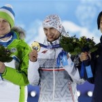 Men's large hill ski jumping medalists, from left, Slovenia's Peter Prevc, bronze, Poland's Kamil Stoch, gold, and Japan's Noriaki Kasai, silver, pose with their medals at the 2014 Winter Olympics in Sochi, Russia, Sunday, Feb. 16, 2014. (AP Photo/Morry Gash)