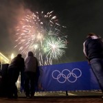 People watch fireworks during an entertainment event associated with the 2014 Winter Olympics, Monday, Feb. 10, 2014, in Krasnaya Polyana, Russia. (AP Photo/Charlie Riedel)
