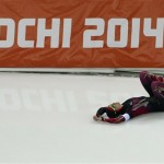 Monique Angermueller of Germany crashes during the women's 1,000-meter speedskating race at the Adler Arena Skating Center during the 2014 Winter Olympics in Sochi, Russia, Thursday, Feb. 13, 2014. (AP Photo/Antonin Thuillier, Pool)