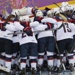 Team USA huddles before facing Canada in the women's gold medal ice hockey game at the 2014 Winter Olympics, Thursday, Feb. 20, 2014, in Sochi, Russia. (AP Photo/Petr David Josek)