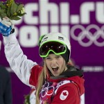 Canada's Justine Dufour-Lapointe celebrates after winning the gold medal in the women's moguls freestyle skiing event at the Rosa Khutor Extreme Park, at the 2014 Sochi Winter Olympics, Saturday, Feb. 8, 2014, in Krasnaya Polyana, Russia. (AP Photo/The Canadian Press, Adrian Wyld)