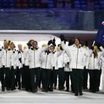 Alex Pullin of Australia, front right, carries that national flag as he leads his team during the opening ceremony of the 2014 Winter Olympics in Sochi, Russia, Friday, Feb. 7, 2014. (AP Photo/Mark Humphrey)