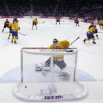 Sweden goaltender Henrik Lundqvist can't stop a goal by Canada forward Chris Kunitz during the third period of the men's gold medal ice hockey game at the 2014 Winter Olympics, Sunday, Feb. 23, 2014, in Sochi, Russia. (AP Photo/David J. Phillip)