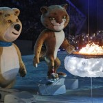 A polar bear and a leopard, mascots of Sochi 2014, approach a flame representing the burning Olympic cauldron, during the closing ceremony of the 2014 Winter Olympics, Sunday, Feb. 23, 2014, in Sochi, Russia. (AP Photo/Dmitry Lovetsky)