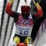 Felix Loch of Germany celebrates as he crosses the finish area to win the gold medal during the men's singles luge final at the 2014 Winter Olympics, Sunday, Feb. 9, 2014, in Krasnaya Polyana, Russia. (AP Photo/Michael Sohn)