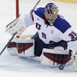 USA goaltender Ryan Miller stops a shot on the goal during the 2014 Winter Olympics men's ice hockey game against Slovenia at Shayba Arena Sunday, Feb. 16, 2014, in Sochi, Russia. (AP Photo/Petr David Josek)