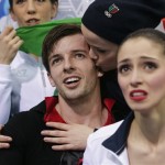 Stefania Berton and Ondrej Hotarek, of Italy, wait for their results after competing in the team pairs free skate figure skating competition at the Iceberg Skating Palace during the 2014 Winter Olympics, Saturday, Feb. 8, 2014, in Sochi, Russia. (AP Photo/Darron Cummings, Pool)