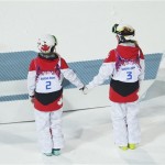  Canada's Justine Dufour-Lapointe, left, celebrates her gold medal in the women's moguls final, with her sister and silver medalist Chloe Dufour-Lapointe, at the Rosa Khutor Extreme Park, at the 2014 Winter Olympics, Saturday, Feb. 8, 2014, in Krasnaya Polyana, Russia. (AP Photo/Sergei Grits)