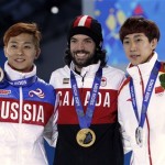 Men's 1,500-meter short track speedskating medalists, from left, Russia's Viktor Ahn, bronze, Canada's Charles Hamelin, gold, and China's Han Tianyu, silver, pose with their medals at the 2014 Winter Olympics in Sochi, Russia, Monday, Feb. 10, 2014. (AP Photo/Morry Gash)