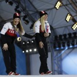 Women's bobsleigh gold medalists Heather Moyse, left, and Kaillie Humphries of Canada smile during their medals ceremony at the 2014 Winter Olympics, Thursday, Feb. 20, 2014, in Sochi, Russia. (AP Photo/David Goldman)