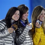 Women's snowboard halfpipe medalists, from left, Kelly Clark of the United States, bronze, Kaitlyn Farrington of the United States, gold, and Australia's Torah Bright, silver, pose with their medals at the 2014 Winter Olympics in Sochi, Russia, Thursday, Feb. 13, 2014. (AP Photo/Morry Gash)