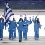Panagiota Tsakiri of Greece carries the national flag as she leads the team during the opening ceremony of the 2014 Winter Olympics in Sochi, Russia, Friday, Feb. 7, 2014. (AP Photo/Mark Humphrey)