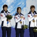 Gold medalists in the women's short track speedskating 3,000-meter relay from South Korea listen to their country's national anthem during their medals ceremony at the 2014 Winter Olympics, Tuesday, Feb. 18, 2014, in Sochi, Russia. (AP Photo/Morry Gash)