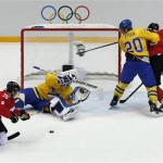Sweden goaltender Henrik Lundqvist saves a shot by Canada forward Martin St. Louis during the second period of the men's gold medal ice hockey game at the 2014 Winter Olympics, Sunday, Feb. 23, 2014, in Sochi, Russia. (AP Photo/David J. Phillip)