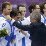 Finland forward Teemu Selanne receives his bronze medal after Finland beat the USA 5-0 in the men's bronze medal ice hockey game at the 2014 Winter Olympics, Saturday, Feb. 22, 2014, in Sochi, Russia. (AP Photo/Mark Humphrey)