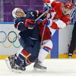 USA forward Zach Parise collides with Russia forward Valeri Nichushkin in the third period of a men's ice hockey game at the 2014 Winter Olympics, Saturday, Feb. 15, 2014, in Sochi, Russia. (AP Photo/Mark Humphrey)