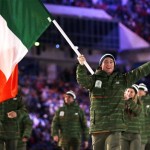 Conor Lyne of Ireland carries his country flag as the Irish team arrives during the opening ceremony of the 2014 Winter Olympics in Sochi, Russia, Friday, Feb. 7, 2014. (AP Photo/Matt Dunham)