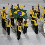 Jaqueline Mourao of Brazil carries the national flag as she leads the team during the opening ceremony of the 2014 Winter Olympics in Sochi, Russia, Friday, Feb. 7, 2014. (AP Photo/Robert F. Bukaty)