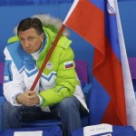 Slovenian President Borut Pahor watches Team Slovenia play Team USA to a 5-1 loss during the 2014 Winter Olympics men's ice hockey game at Shayba Arena Sunday, Feb. 16, 2014, in Sochi, Russia. (AP Photo/Petr David Josek)