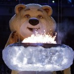 A large mascot blows out the Olympic flame with his breath during the closing ceremony of the 2014 Winter Olympics, Sunday, Feb. 23, 2014, in Sochi, Russia. (AP Photo/Charlie Riedel)