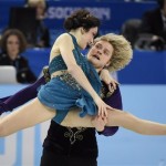Meryl Davis and Charlie White, of the United States, perform their free dance in the ice dance portion of the team figure skating event at the Winter Olympics, Sunday, Feb. 9, 2014, in Sochi, Russia. (AP Photo/The Canadian Press, Paul Chiasson)