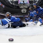 Finland goalkeeper Kari Lehtonen can't stop a goal during a men's semifinal ice hockey game against Sweden at the 2014 Winter Olympics, Friday, Feb. 21, 2014, in Sochi, Russia. (AP Photo/Julio Cortez, Pool)