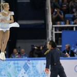 Tatiana Volosozhar and Maxim Trankov of Russia compete in the team pairs short program figure skating competition at the Iceberg Skating Palace during the 2014 Winter Olympics, Thursday, Feb. 6, 2014, in Sochi, Russia. (AP Photo/Bernat Armangue)